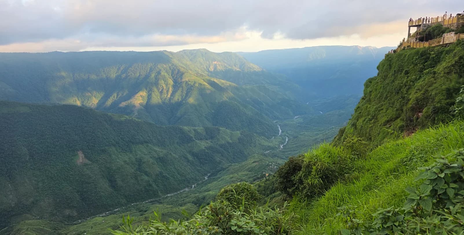 Sunlight falling across the green hills and deep gorge of Laitlum Canyon